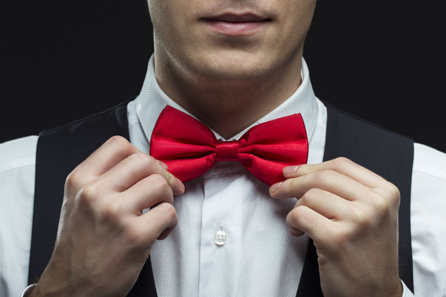 black dress shirt with red bow tie