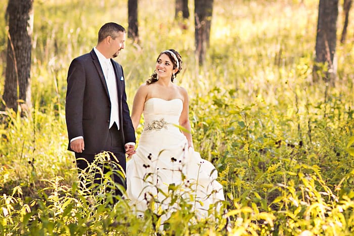 Real Wedding: Chelsea and Clark Walking Through Meadow