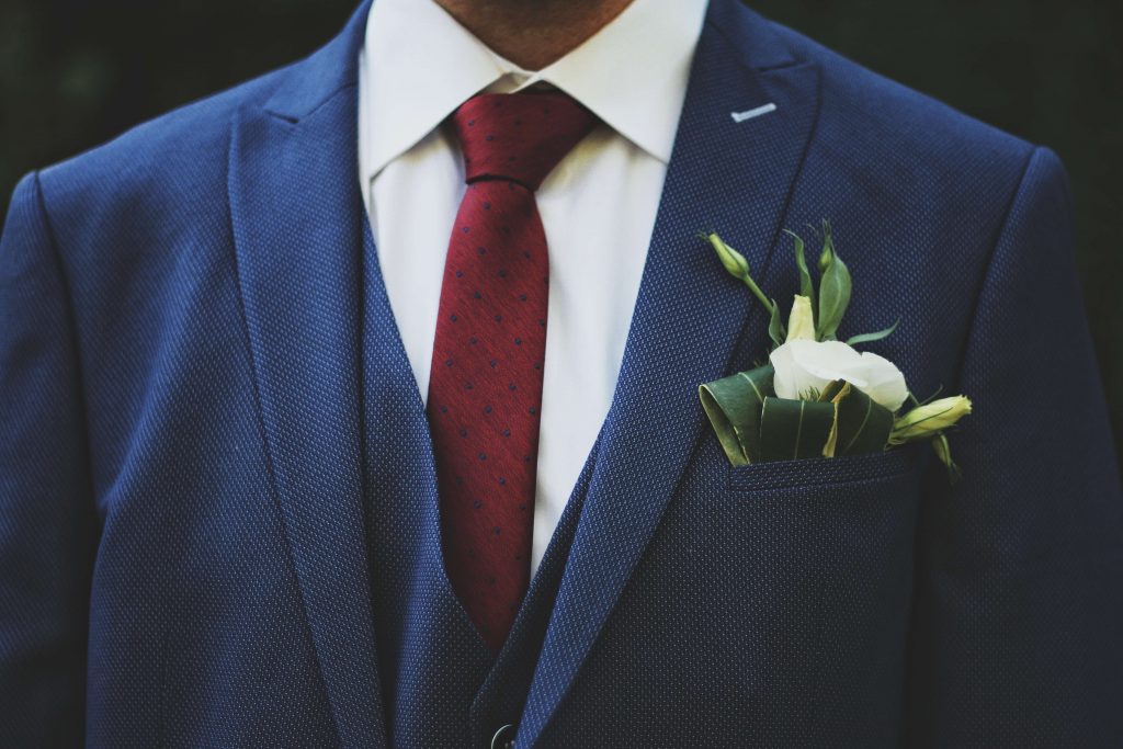 blue shirt and navy suit