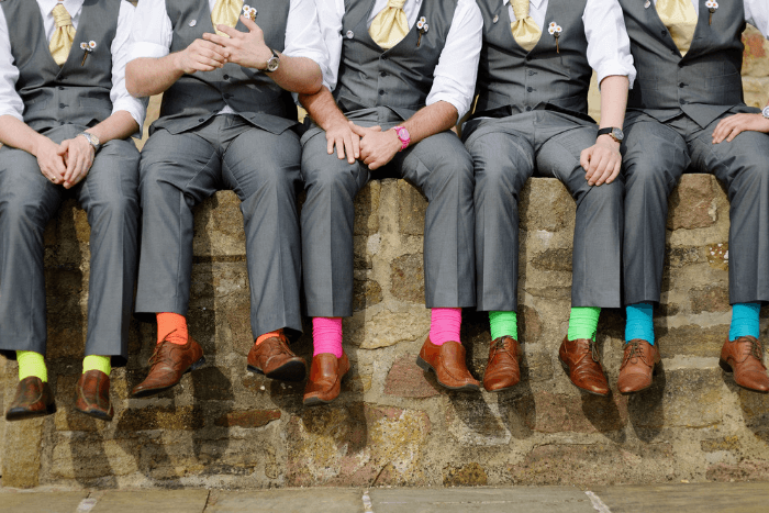 Grey suits with colorful socks