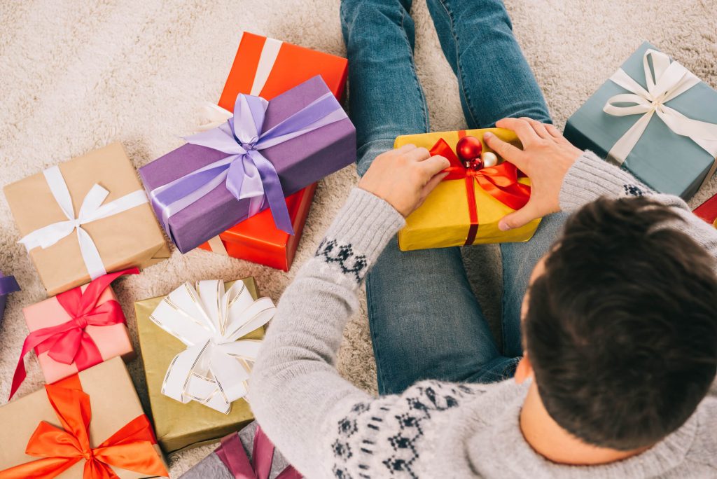 man opening gifts