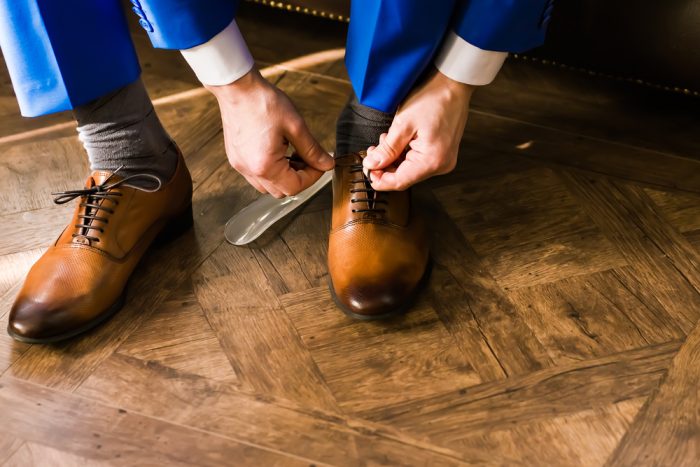 Man tying dress shoes