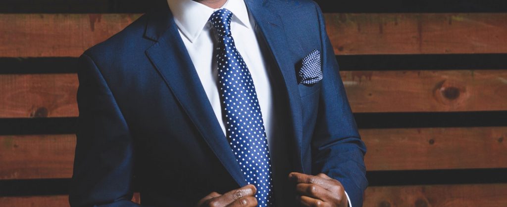 How to Choose the Right Tie - Man in a blue suit with a tie