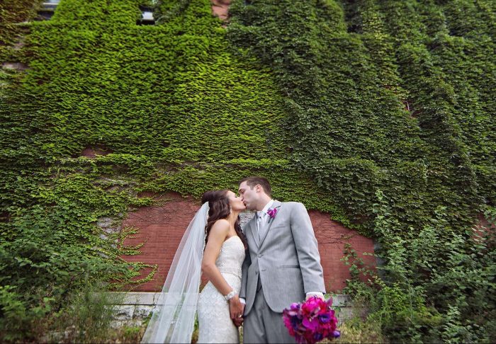 Groom in a wedding tux picked for the weather with his bride - Jim's Formal Wear