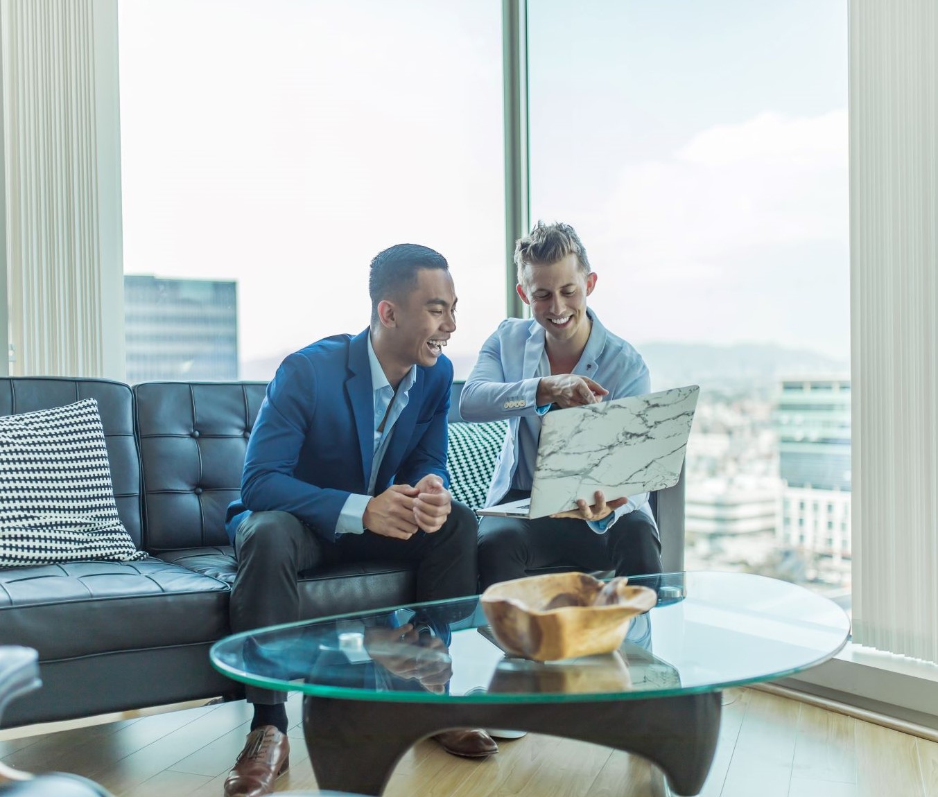 when to wear a suit to an interview - two business men reviewing a document