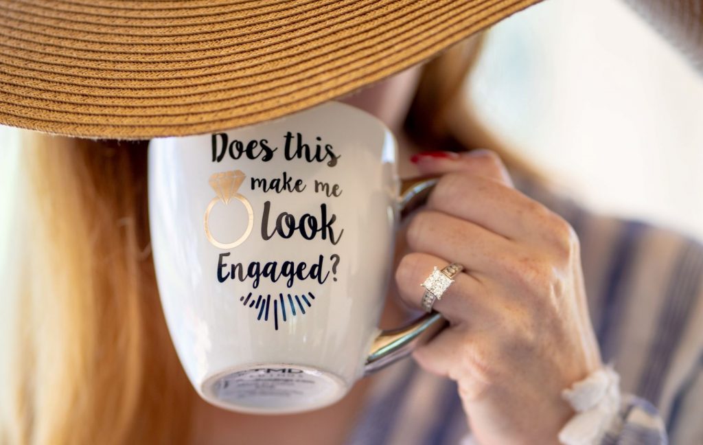 How to Pick Out an Engagement Ring - Woman with a ring and a coffee cup