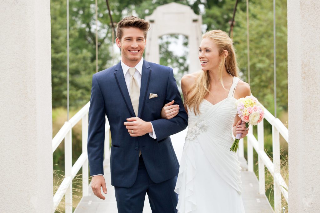 How to clean a suit at home without dry cleaning - A man in a blue suit with the bride