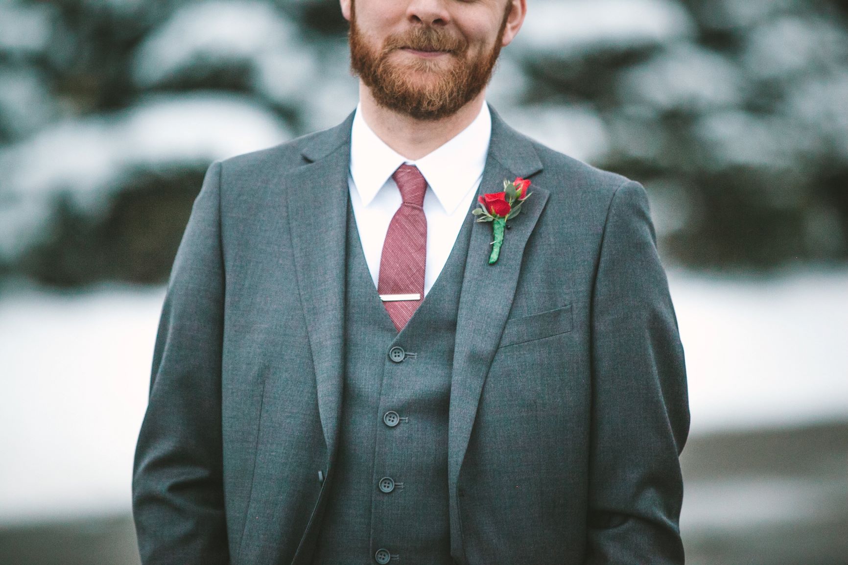 Winter Boutonnieres - Man with a simple red rose boutonniere