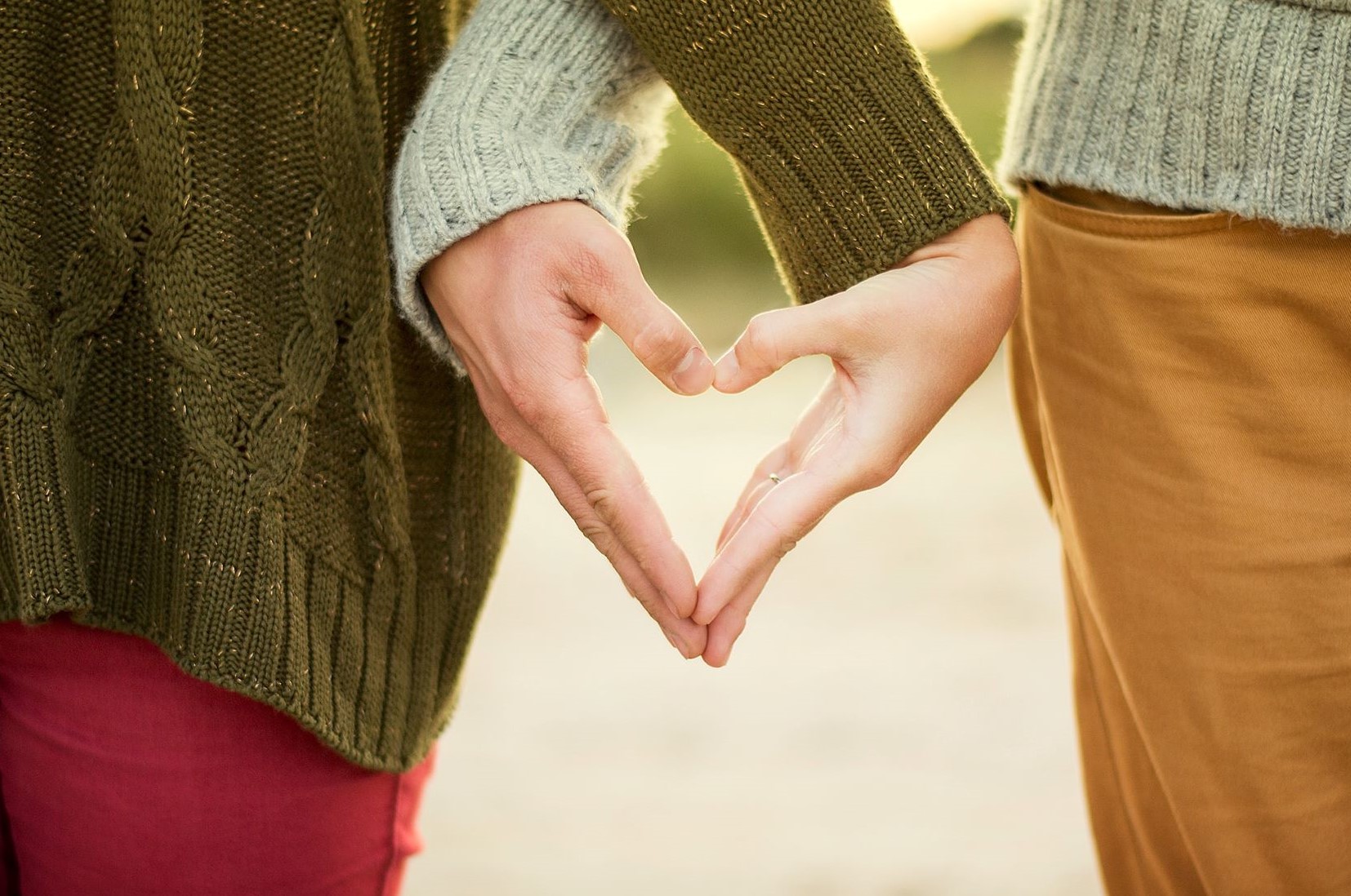 How to have a special Valentine's day - Couple making a heart with their hands