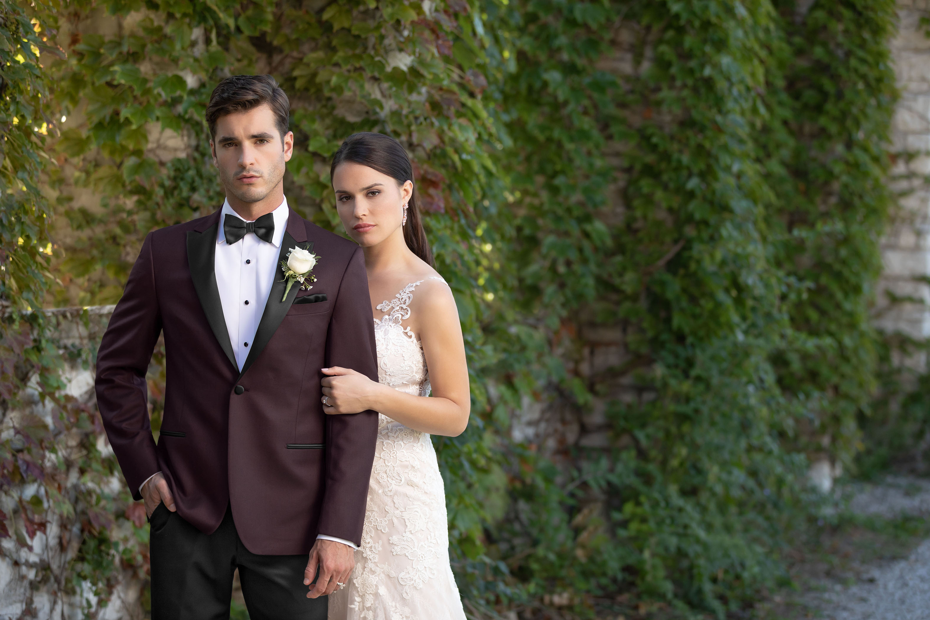 Non-traditional wedding looks - Groom and bride, groom wearing a burgundy tuxedo