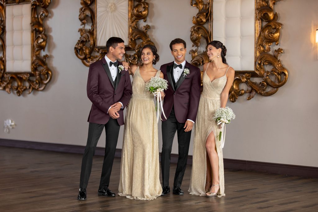 non-traditional wedding looks - Two men in burgundy tuxedos with two bridesmaids