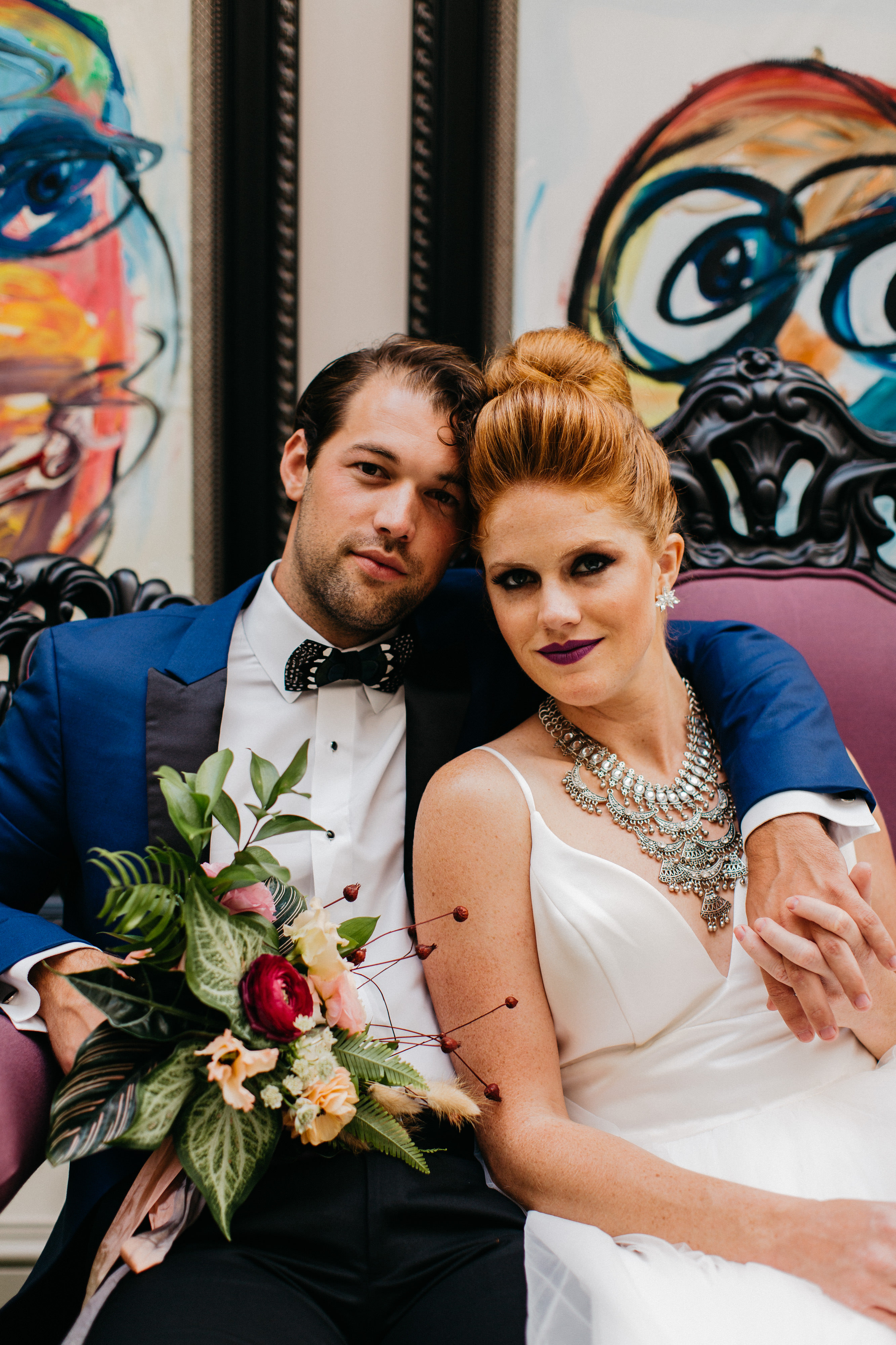 wedding couple sitting on couch