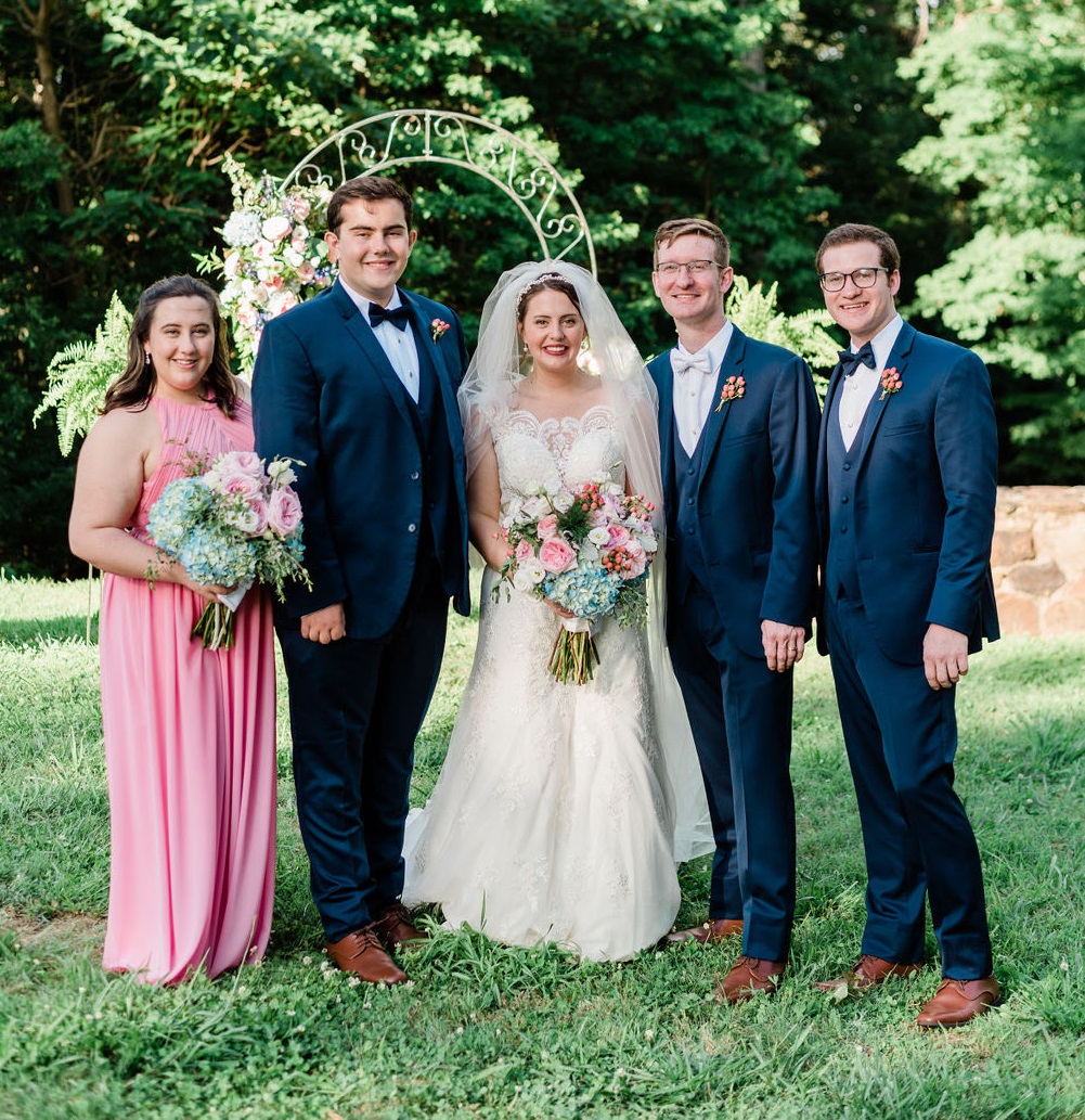 minimony or microwedding - couple with witnesses in blue suits