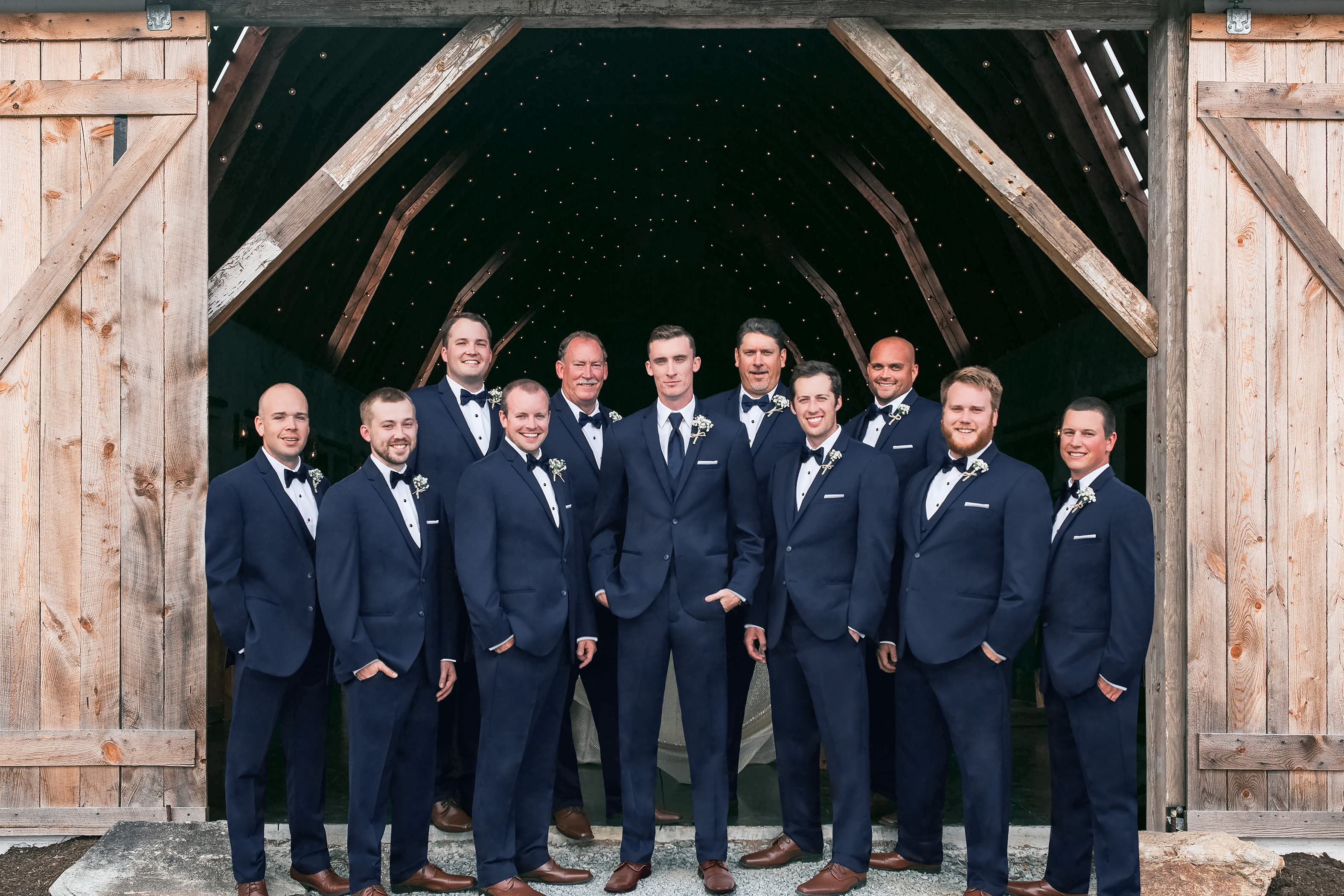 how to order groomsmen tuxedos - groomsmen posing in blue suits