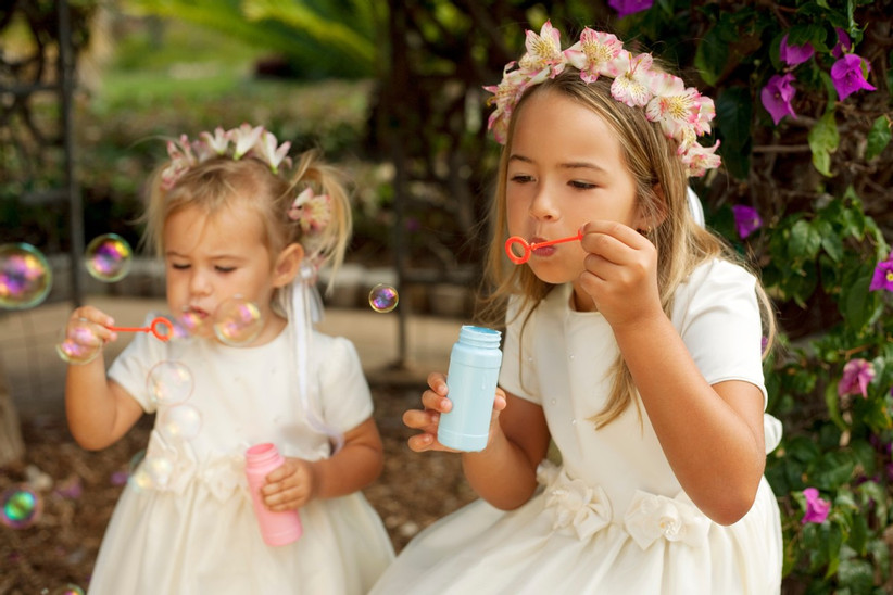 flower girls blowing bubbles