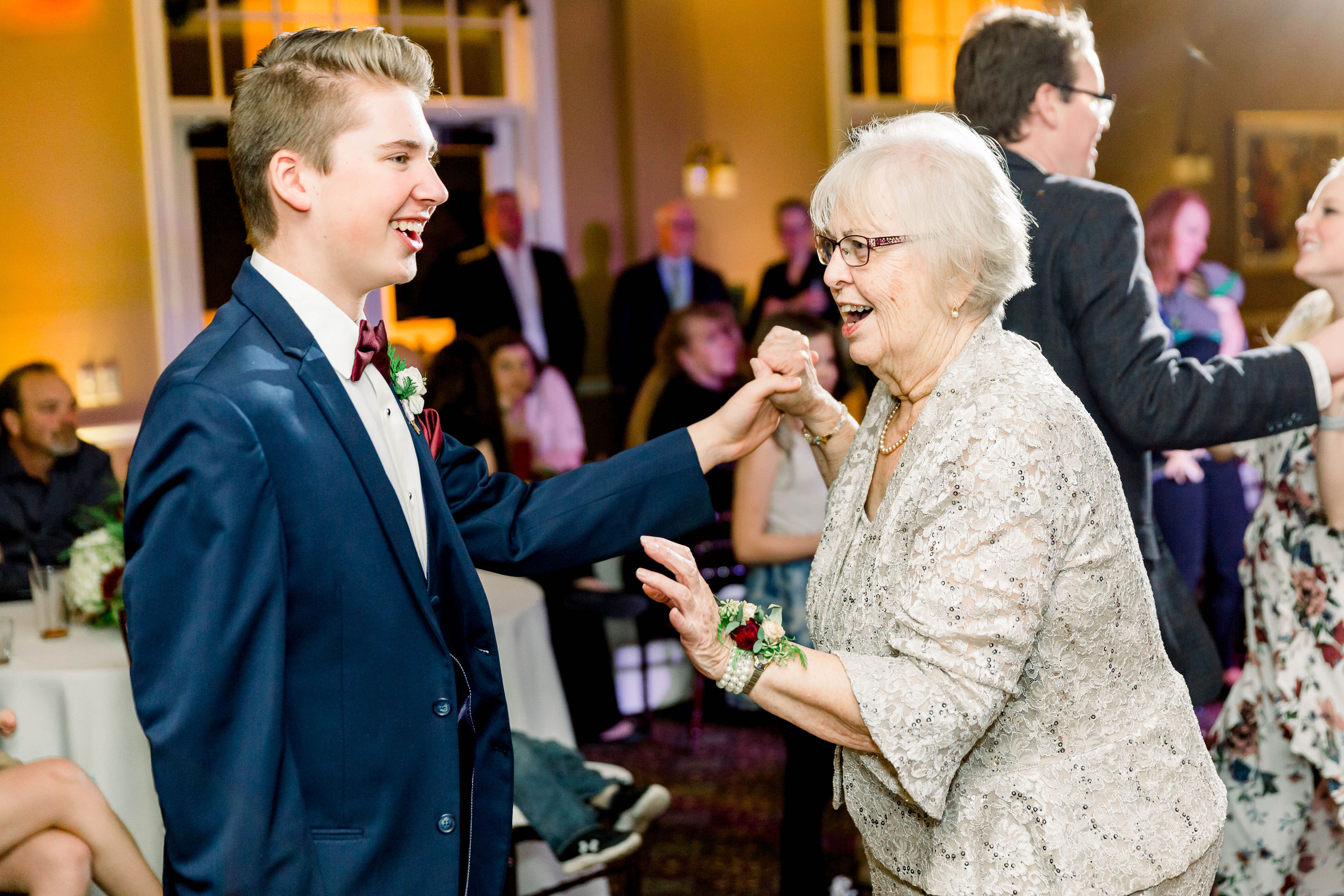 grandmother grandson dancing at winter wedding