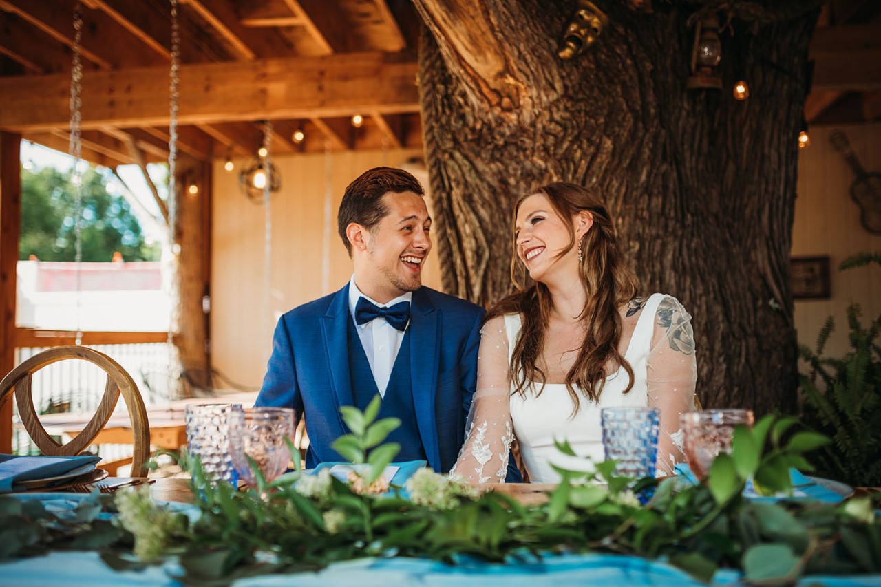 eco-friendly wedding, bride groom at table laughing