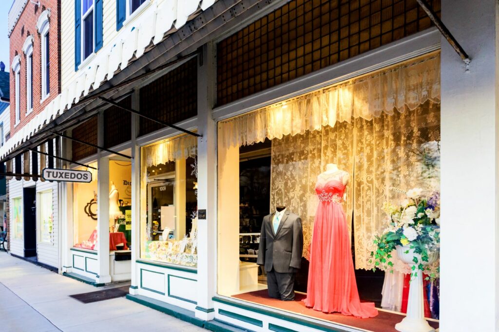 support small businesses - tuxedo rental shop store front