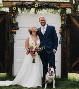 bride and groom with pit bull