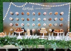 wall of donuts and cake plate with donuts stacked