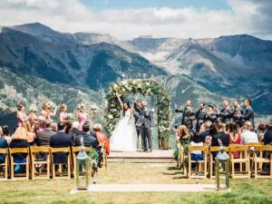 Outdoor wedding ceremony overlooking the mountains. Festive Americana Wedding Must Haves.