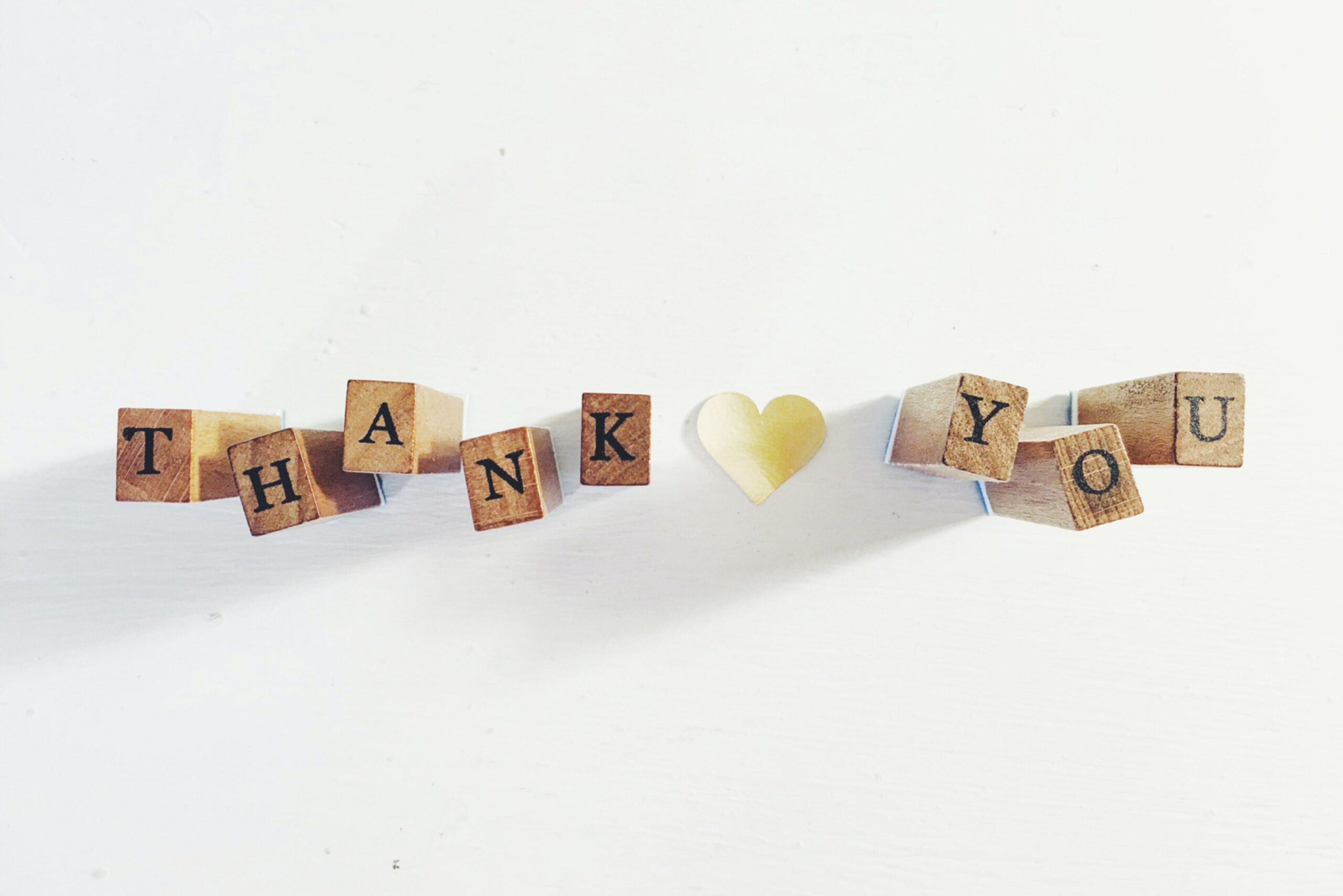 wooden blocks spelling out the words thank you