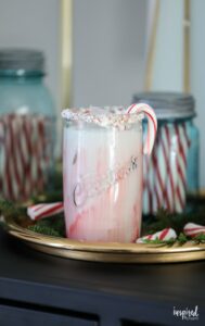 Peppermint White Russian with crushed candy canes on rim of glass