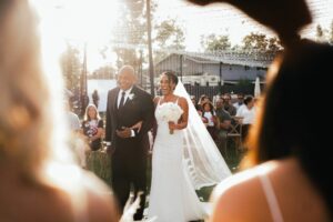 bride and father walking down aisle