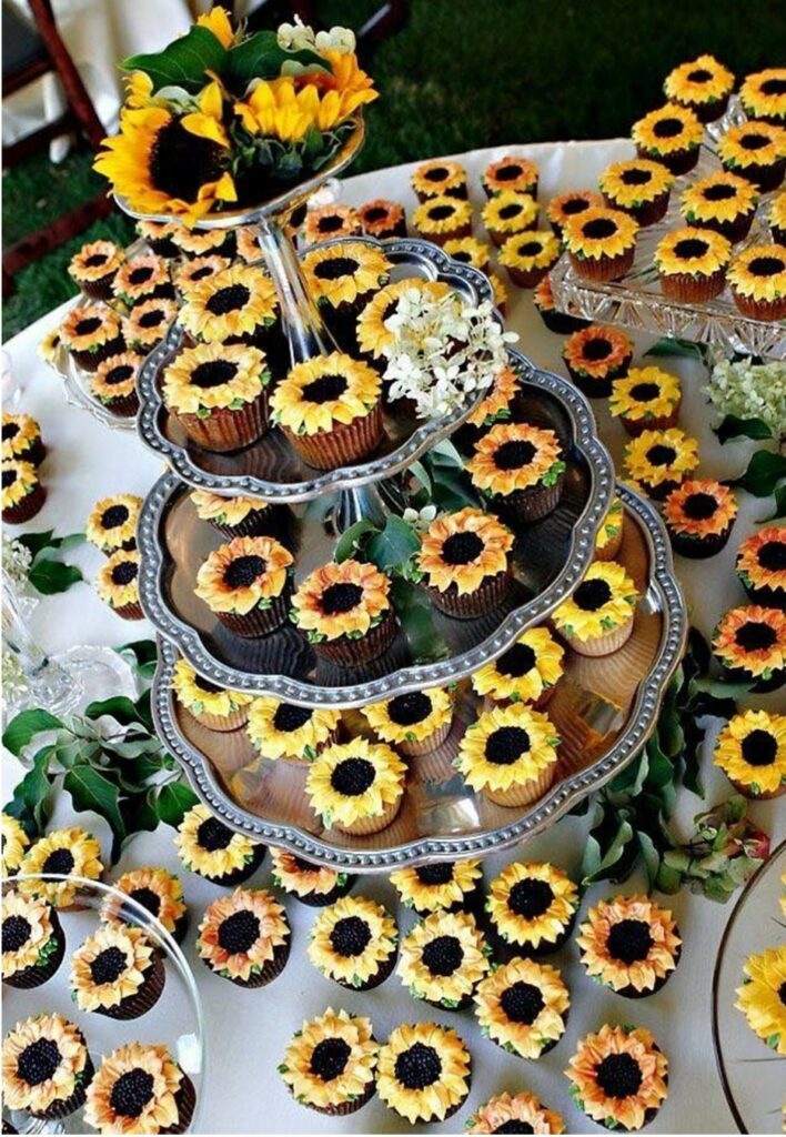 country wedding cake table with cupcakes decorated as sunflowers