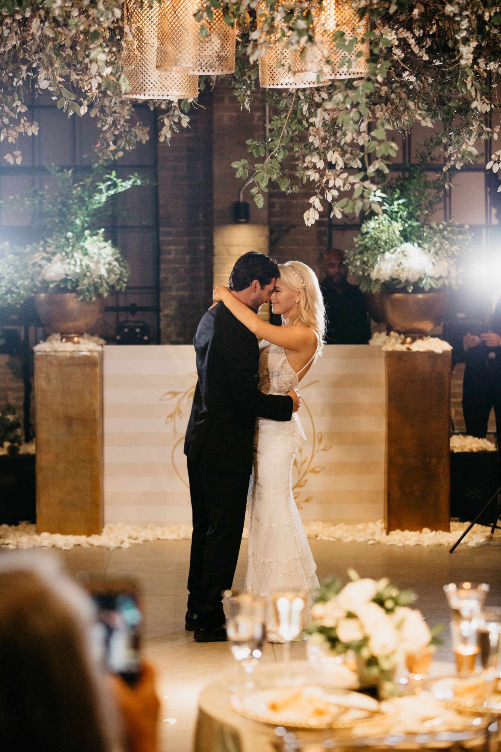 bride and groom at their wedding, dancing their first dance together