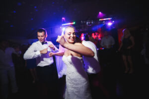 bride and groom dancing to a fast paced, party song