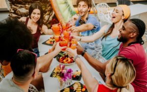 group of young adults toasting at brunch