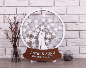 snow globe drop box for a winter wedding. Guests sign snowflakes, drop them into globe