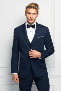 guy wearing navy suit and bow tie