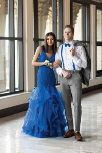 prom trends - prom couple with girl in blue and guy wearing matching accessories