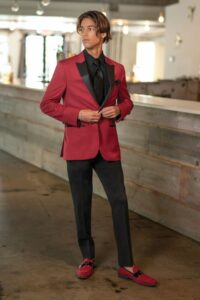 prom trends - red tuxedo jacket with black lapels, coordinating black pants, and red loafers