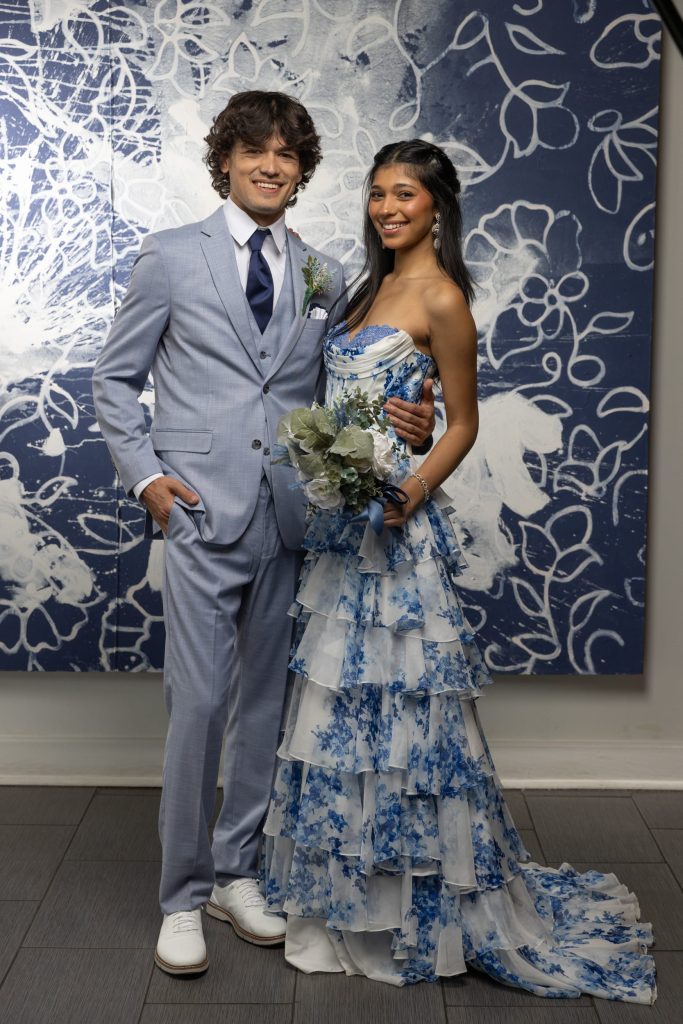Prom couple in a light blue patterned dress and oxford blue suit