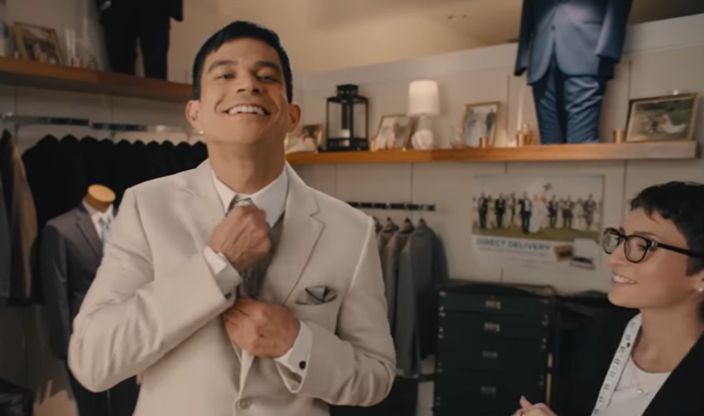 Trying on a Jim's Formal Wear suit at a local retailer